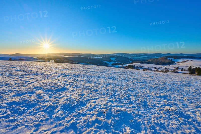Clear sunrise over snow-covered hills, winter, Wasserkuppe, Gersfeld, Rhön, Hesse, Germany