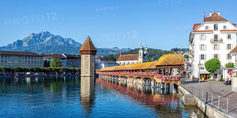 Lucerne city on the river Reuss with Chapel Bridge and Mount Pilatus panorama in Lucerne, Switzerland