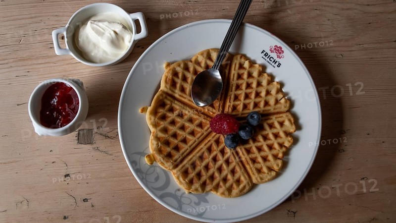 Waffle with raspberry, blueberries, strawberry jam and cream, Kongsvoll or Kongsvold Fjeldstue, historic mountain hut, Drivdalen valley, Dovrefjell, Oppdal municipality, Trøndelag county, Norway