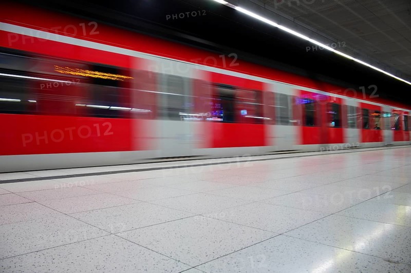 Underground arriving S-Bahn, train, class 420 in traffic red, platform, stop, city centre station, public transport, movement effect, Stuttgart, Baden-Württemberg, Germany
