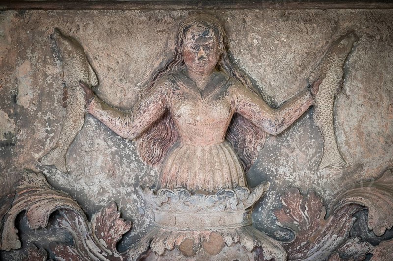 Woman holding fish in her hands, frieze, Städtisches Lapidarium, City of Stuttgart, Baden-Württemberg, Germany