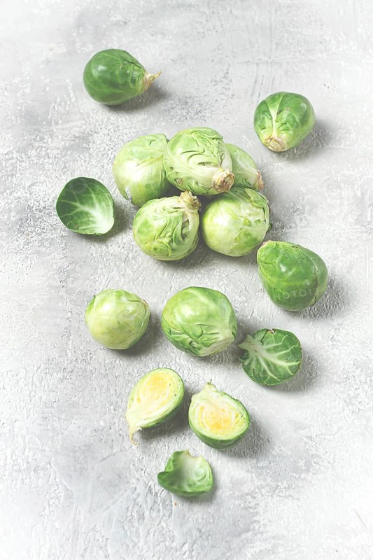 Fresh Brussels sprouts, raw, top view, on a gray table, no people