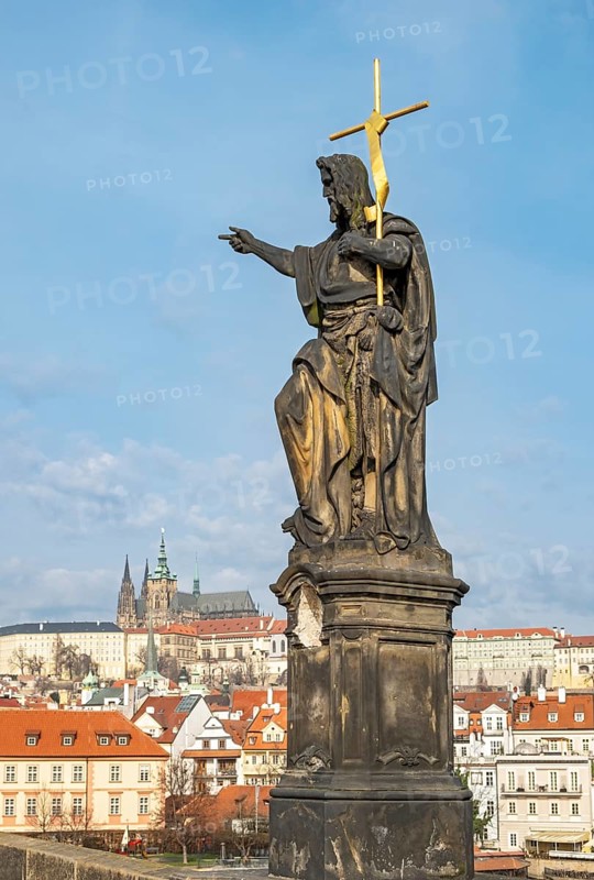 Statue of John the Baptist with the Prague Castle, Charles Bridge, Praha, Czech Republic