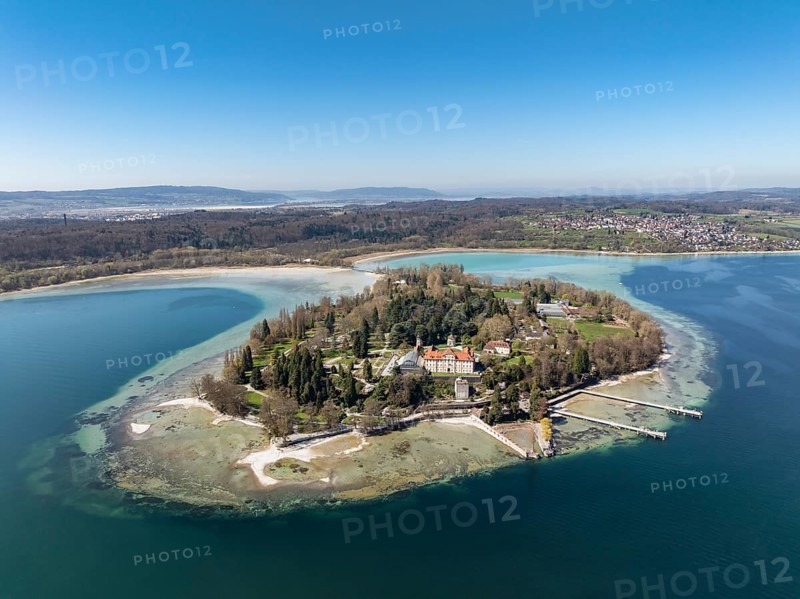 Aerial view of the island of Mainau at low tide with spring-like vegetation, on the horizon the village of Litzelstetten and the Bodanrück, district of Constance, Baden-Württemberg, Germany
