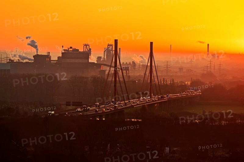 Atmospheric view of the ThyssenKrupp plant with the A 42 motorway at sunrise, Duisburg, North Rhine-Westphalia, Germany