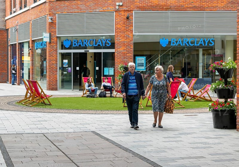 Pedestrianised area with deckchairs outside Barclays bank, Parkway shopping centre, Newbury, Berkshire, England, UK