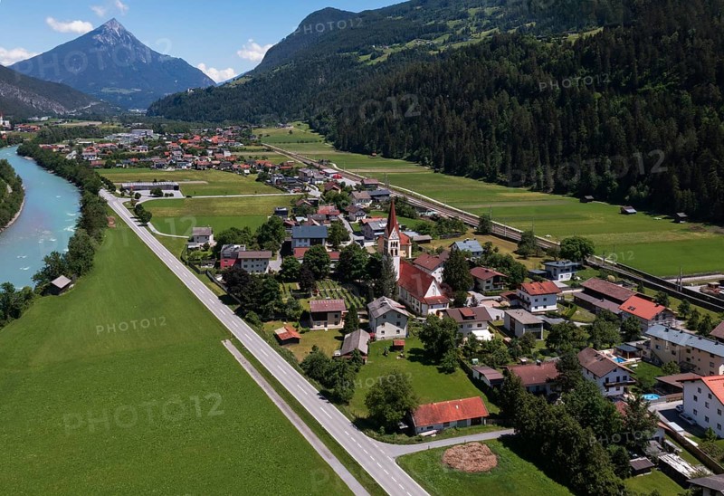 Drone shot, view of village with parish church, Schönwies, Inn, Oberinntal, Tyrol, Austria