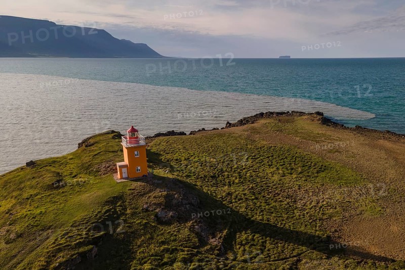 Drone picture, aerial view, lighthouse Hegranesviti, Hegranes, peninsula Landsendi, in the background island Drangey, near Sauðárkrokur, Skagafjörður, Iceland