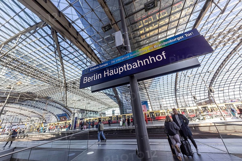 Berlin Central Station with station sign, pillarless glass roof construction above the platforms. Berlin, Germany