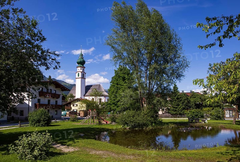 View of the village with parish church, Breitenbach am Inn, Inntal, Tyrol, Austria