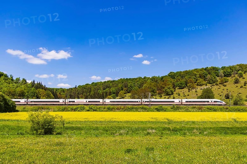 InterCityExpress ICE travelling across the Swabian Alb. Idyllic landscape in spring. Lonsee, Baden-Württemberg, Germany