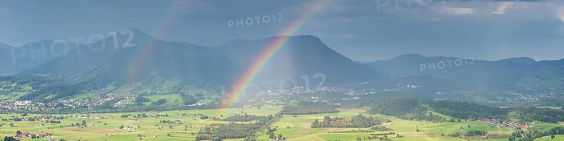 Panorama from the Grünten over the Illertal with rainbow to Blaichach and Immenstadt, behind Steineberg, 1660m and Mittagberg, 1451m, Allgäu Alps, Allgäu, Bavaria, Germany
