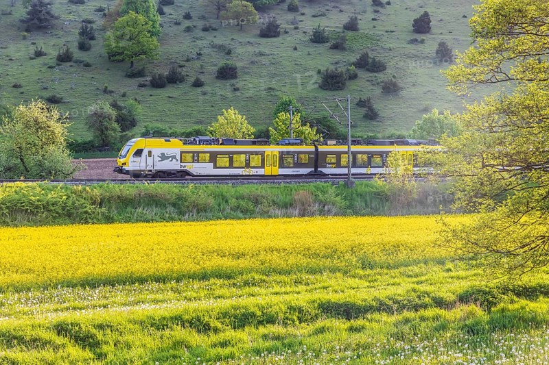 Regional railway, operated by Arverio, travelling across the Swabian Alb. Landscape near Lonsee in spring. Lonsee, Baden-Württemberg, Germany