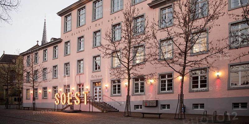 Illuminated town hall in the early evening at the Winterstrahlen Festival of Lights in Soest, North Rhine-Westphalia, Germany