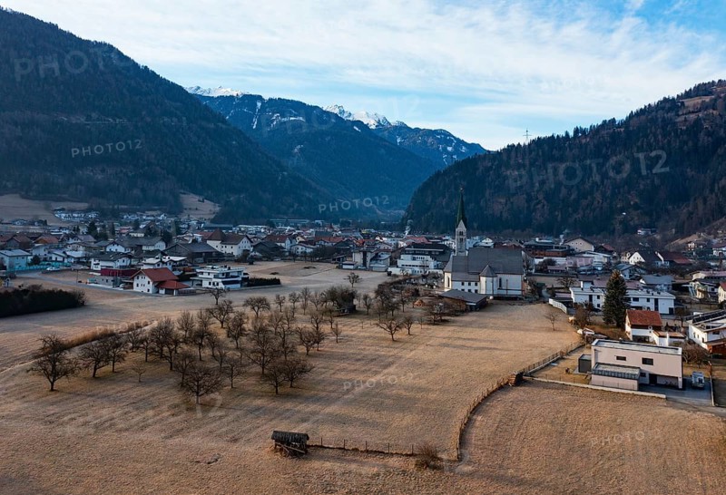 Drone shot, view of village with parish church, Prutz, Kaunertal, Inntal, Tyrol, Austria
