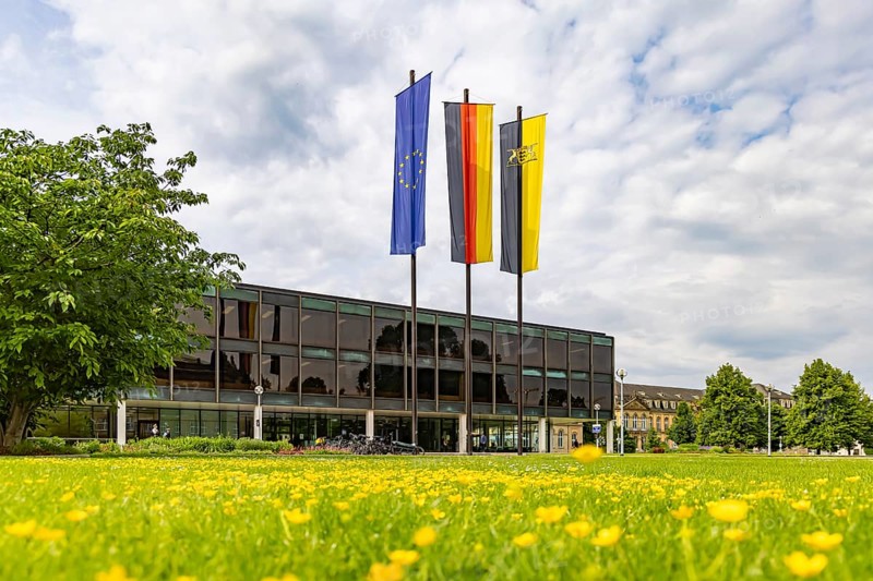 House of the state parliament of Baden-Württemberg, state parliament building in Stuttgart. Flags above the building on a session day. The Haus des Landtags was built between 1959 and 1961 according to a design by Kurt Viertel. From 2013 to 2016, the listed building was completely renovated and brought up to technical standards. Stuttgart, Baden-Württemberg, Germany