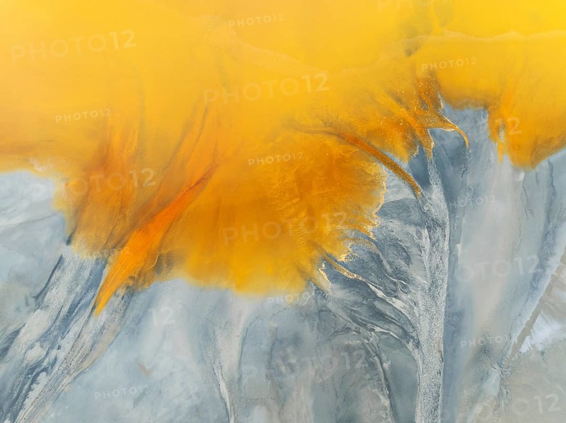 Waste pond in the mineral-rich area of the Rio Tinto mines. The colour is caused by oxidised iron minerals. Aerial view. Drone shot. Huelva province, Andalusia, Spain