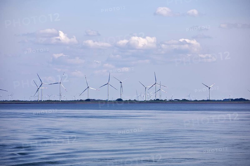 Schleswig-Holstein Wadden Sea National Park with a view of wind turbines on the mainland, North Frisia, Germany