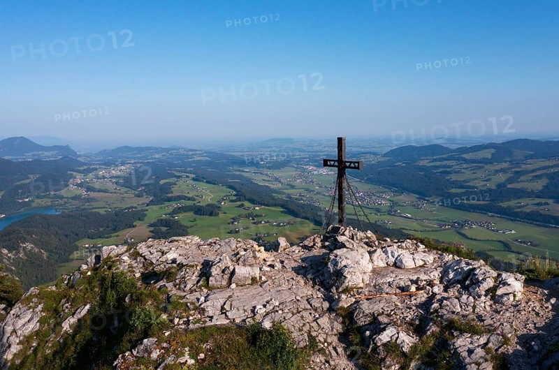 Summit cross on the Schober with view to Thalgau, Osterhorn group, Salzkammergut, Salzburg province, Austria