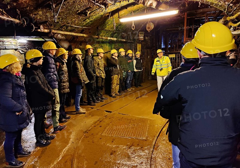 Group of visitors in front of the rope basket, Rammelsberg Ore Mine, UNESCO World Heritage Site, Goslar, Lower Saxony, Germany