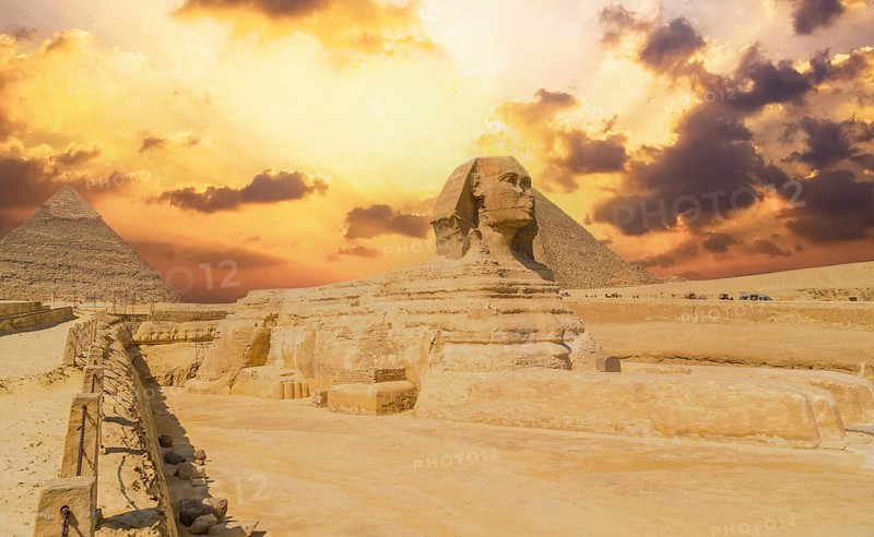 The Great Sphinx of Giza and in the background the Pyramids of Giza, the oldest Funerary monument in the world. In the city of Cairo, Egypt
