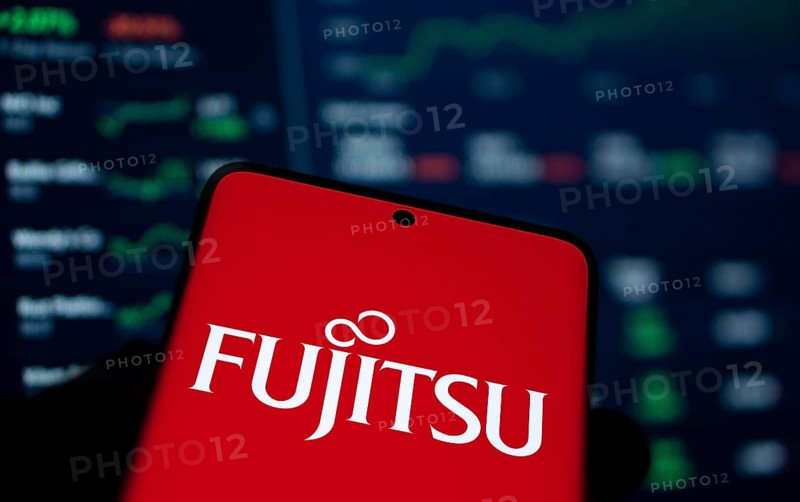 Fujitsu logo is displayed on smartphone. Fujitsu limited is a Japanese multinational tech company.