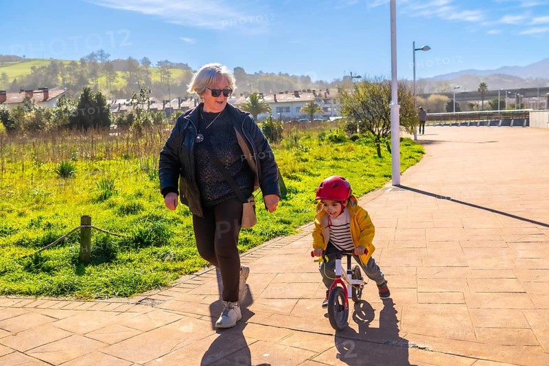Grandmother and grandson enjoying time together outdoors, promoting family bonding and healthy lifestyle