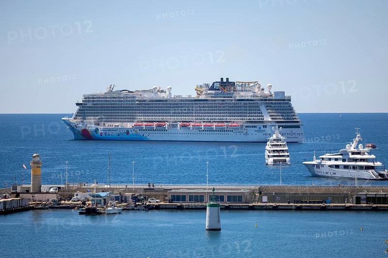 Cannes, France - 23 May 2024: A cruise ship anchors in front of the beach on the Promenade de la Croisette during the 78th Cannes International Film Festival. The film festival will take place from 13 to 24 May 2025