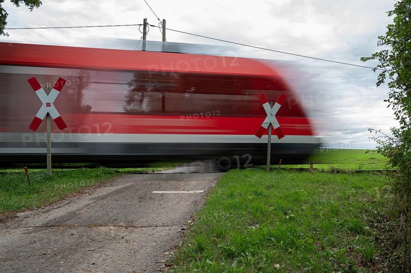 Passing Gräfenberg railway, single-track branch line, at the unrestricted level crossing, Igensdorf, Upper Franconia, Bavaria, Germany