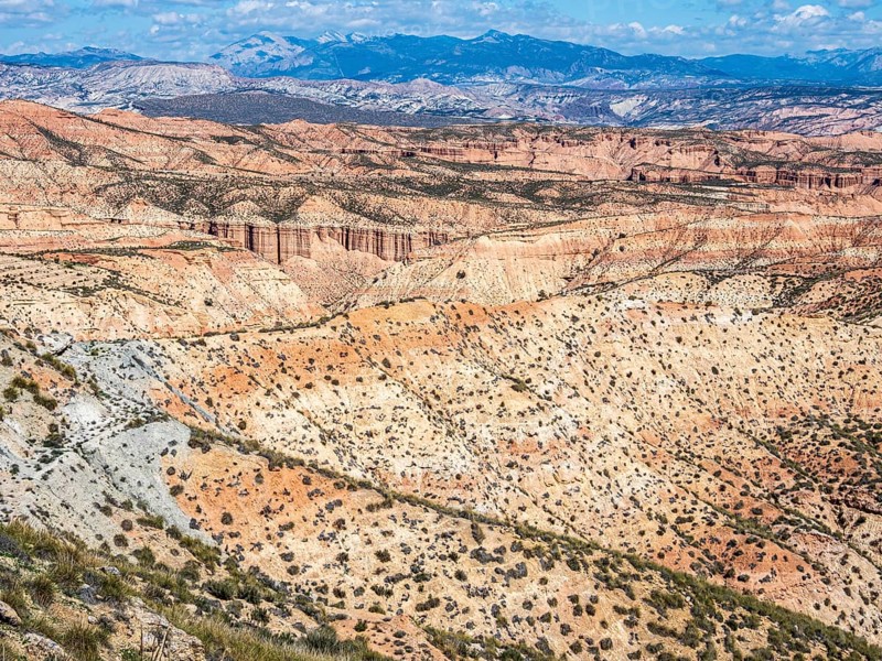 View over the Gorafe desert, colorful canyons, rock formations, Gorafe Desert, UNESCO Granada Geopark, Granada province, Andalusia, Spain