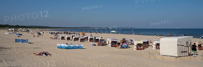 Beach chairs and tourists on the sandy beach, Swinemünde, Usedom Island, Baltic Sea, Poland