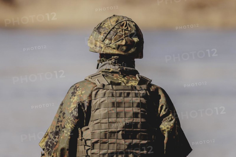 A soldier with helmet, taken during the military exercise 'Wettiner Schwert' with German and Czech soldiers near Tangermünde, 26 March 2024. 'Wettiner Schwert' is part of the NATO Quadriga exercise