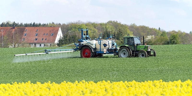Agriculture, pesticide being sprayed on a field in spring, Swabian Alb, Baden-Württemberg, Germany