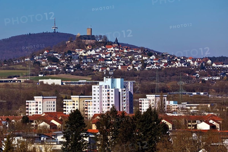 View of residential buildings, Gleiberg Castle in the municipality of Wettenberg and the telecommunications tower on the Duensberg, Giessen, Hesse, Germany