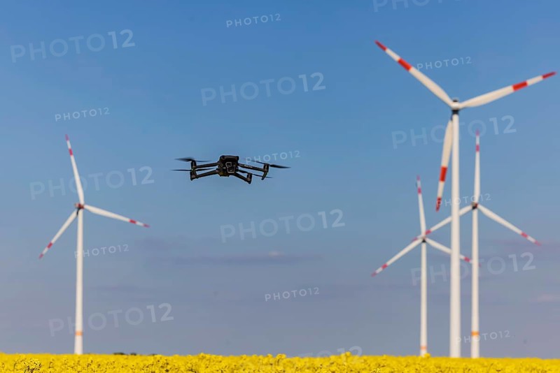 A Mavic 3 Pro drone flies for a wind turbine in a wind farm. Dornstadt, Baden-Württemberg, Germany