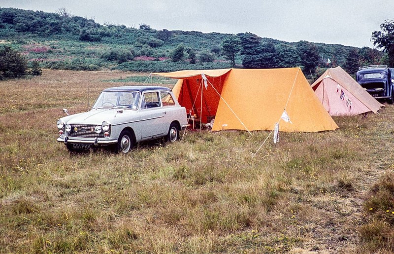Austin A40 Farina caravan site with tents, Pembrokeshire, West Wales, UK around 1960