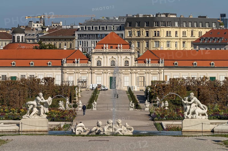 Fountain in the palace gardens and the Lower Belvedere in Vienna, Austria