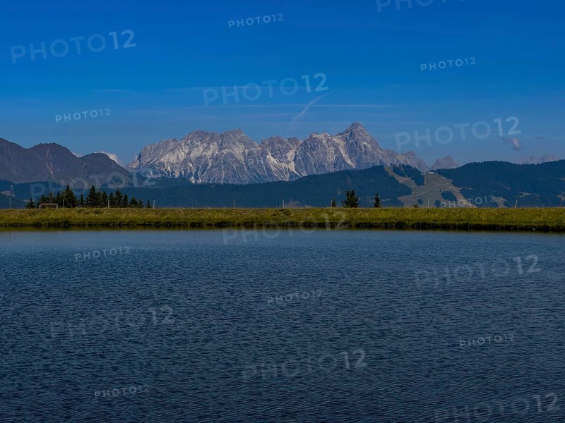 Tyrolean mountains near Saalbach-Hinterglemm, view over the Zwölferkogel reservoir, behind Leonganger Steinberge, highest peak Birnhorn at 2, 634 metres, Tyrol, Austria