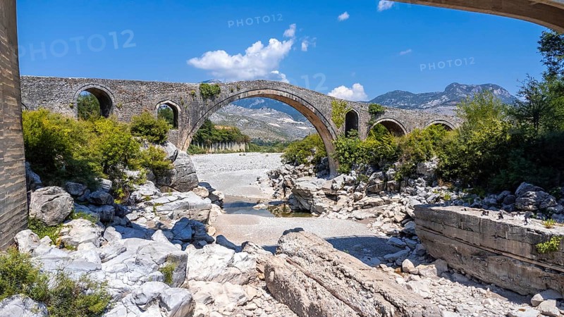 Aerial view of the Old Mes bridge near Shkoder from above. Albania, Europe. Ottoman stone arch bridge Ura e Kadiut