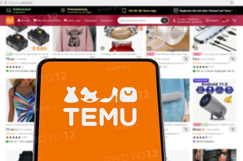 Temu Logo online marketplace from China online trading ecommerce on a mobile phone and website on computer screen in Stuttgart, Germany
