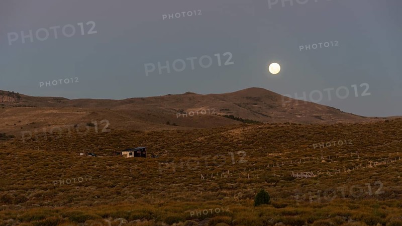 Full moon rises over the Patagonian steppe near Junin de los Andes, Patagonia, Argentina