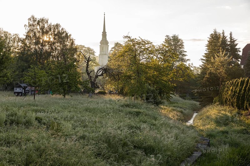 Morning atmosphere with Cunewalde water and village church, Cunewalde, Saxony, Germany