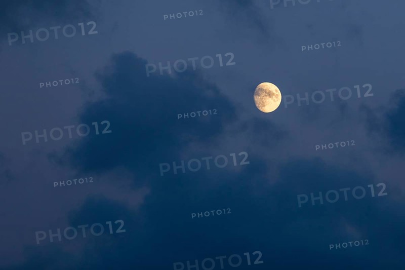Moon in a slightly cloudy evening sky, Germany