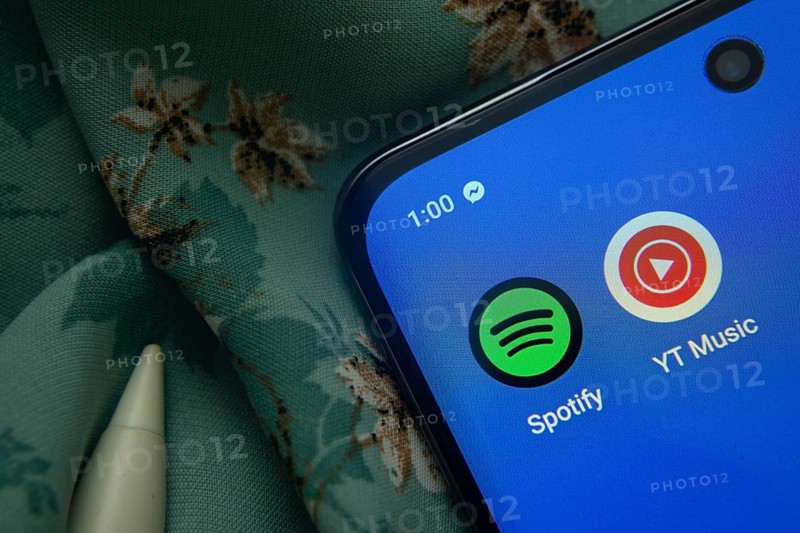 Dhaka, Bangladesh- 07 May 2025: Spotify and Youtube Music app icon is seen on smartphone