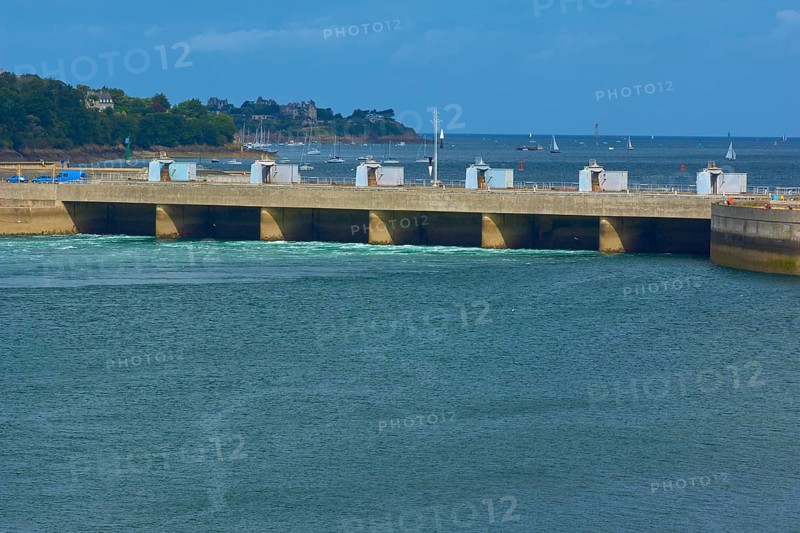 Rance tidal power station and a wooded coastline under a blue sky, La Rance, Saint-Malo, La Richardais, Brittany, France
