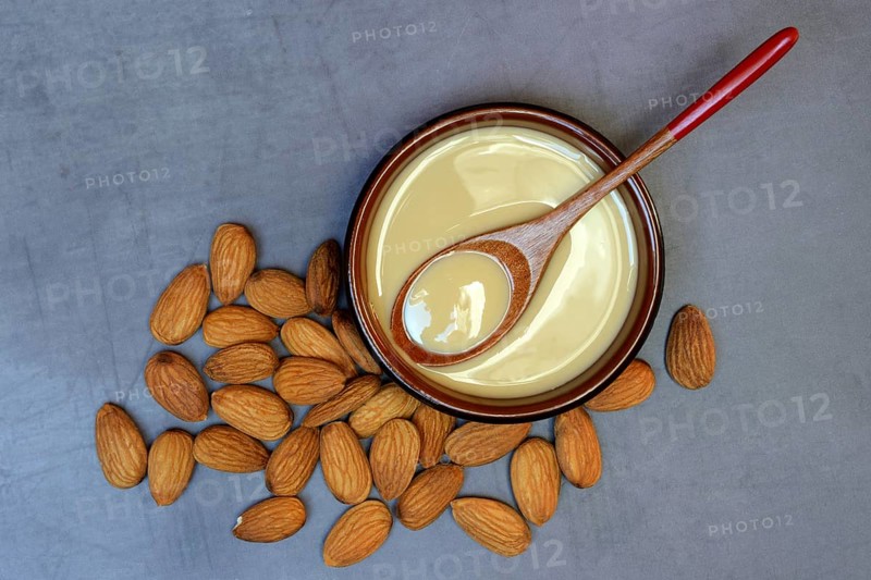 White almond cream in small bowls, almond butter