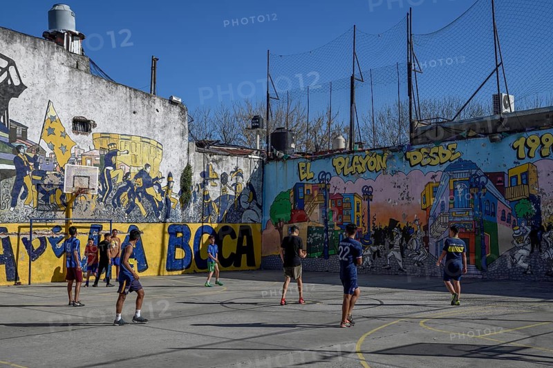 Young footballers on a football field, La Boca district, Buenos Aires, Argentina