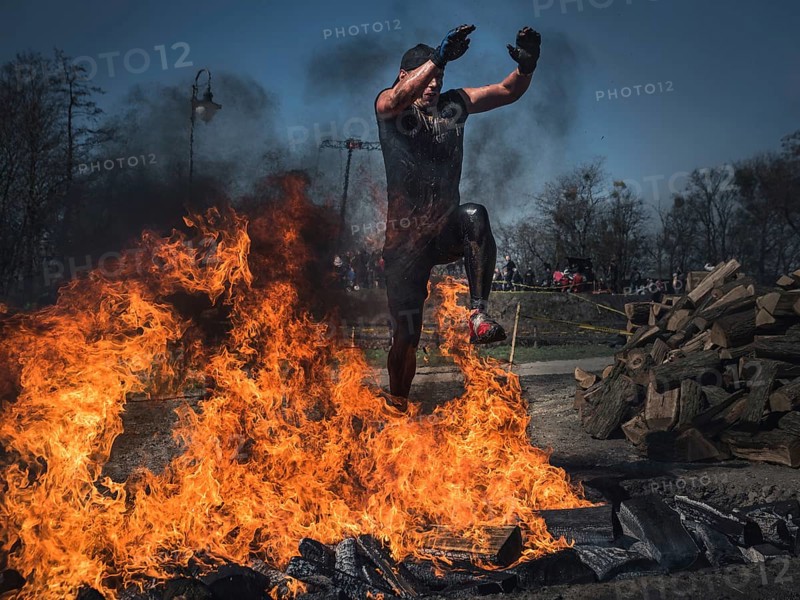 WROCLAW, POLAND - APRIL 7, 2018: Extreme running with obstacle RUNMAGEDDON. In the picture a runner on the Recruit route