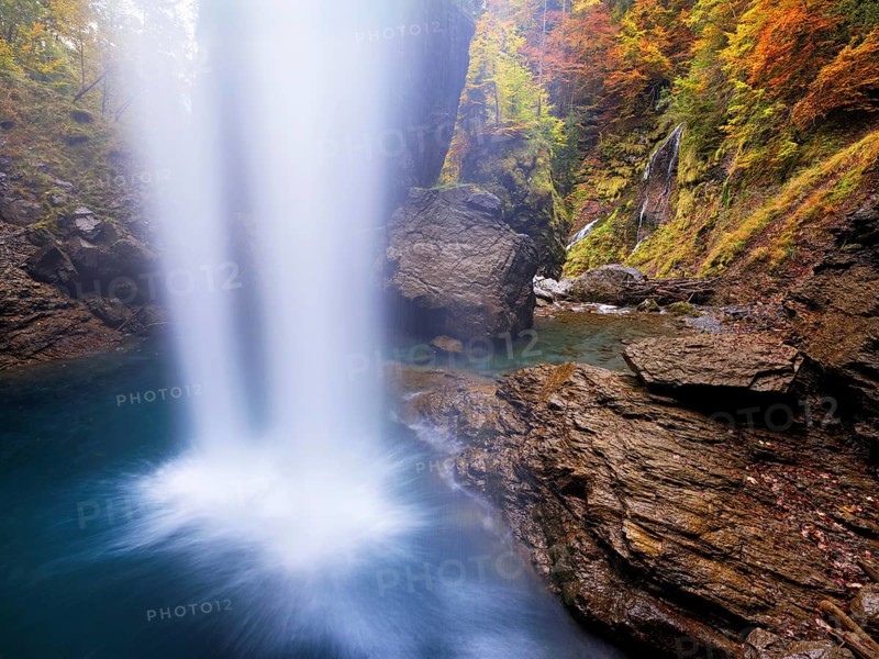 Waterfall mountain list in autumn-colored surroundings, Linthal, Klausenpass, Canton of Glarus, Switzerland