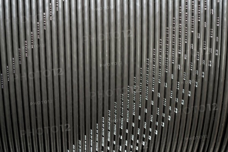 Black broadband cable on a spool, Oberweser, Weser Uplands, Weserbergland, Hesse, Germany